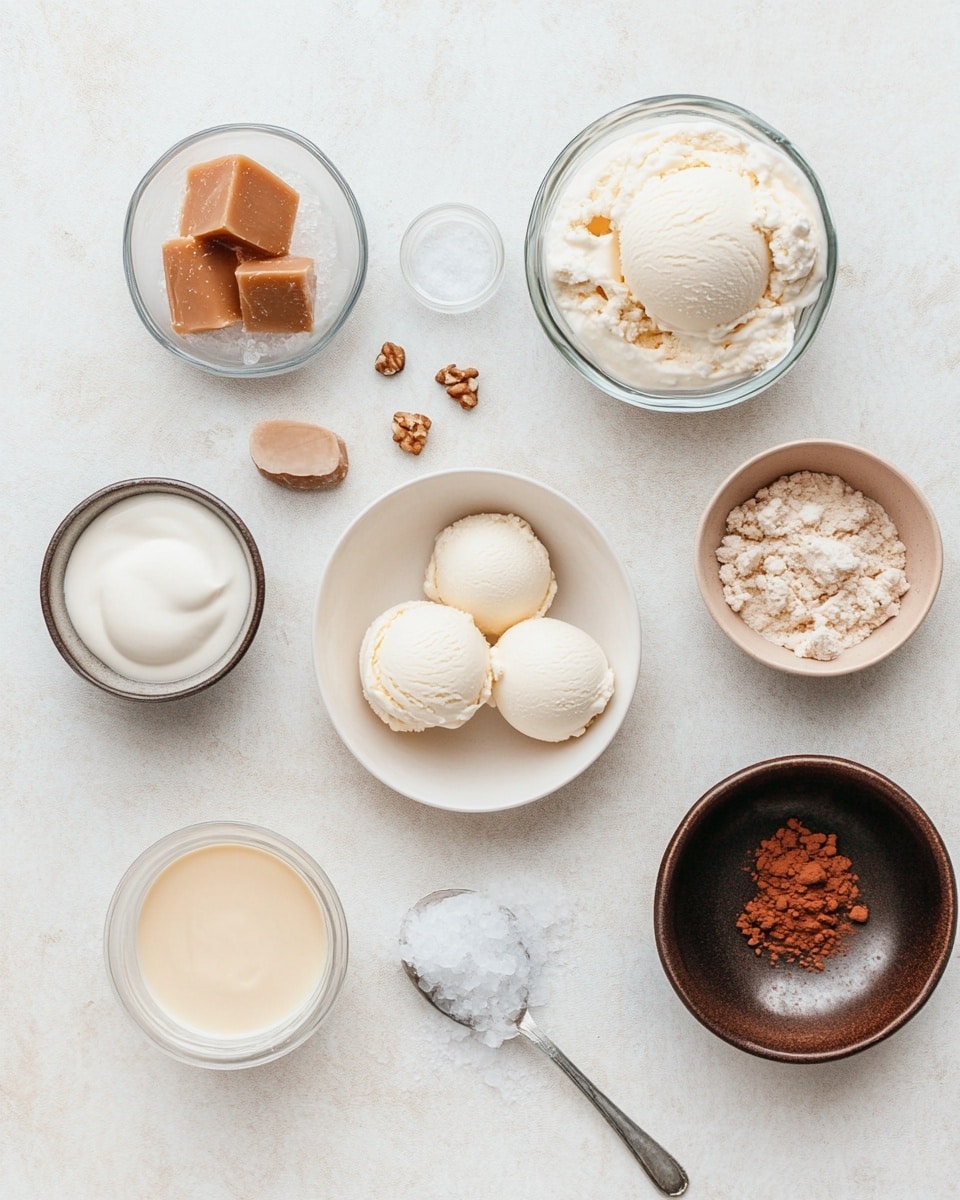 A tall clear glass mug filled with a light brown frothy iced coffee drink that has a creamy texture. On top, there is a tall swirl of white whipped cream with a drizzle of golden caramel sauce flowing down. The mug is held by a woman's hand with a blurred background of a few stacked colorful books and a white marbled surface. Photo taken with an iphone --ar 4:5 --v 7