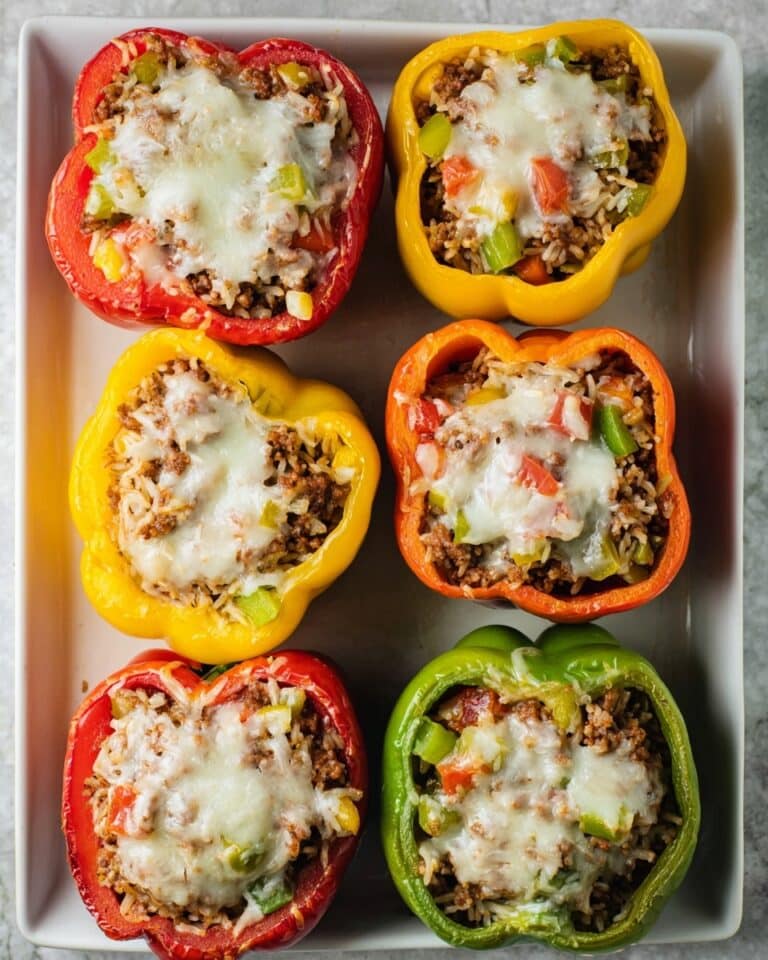 Savory Stuffed Bell Peppers with Ground Beef, Rice, and Melted Cheese Recipe