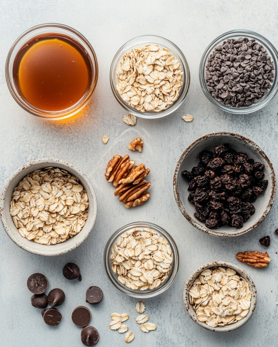 The image shows two stacked rectangular oat bars with visible layers of oats, chocolate chips, and a sticky syrup binding them together. The bars have a rough texture with chunks of dark chocolate scattered inside and three chocolate chips on top of each bar. The bars sit on a piece of white paper over a white marbled surface, and a few loose chocolate chips are scattered nearby. The colors are warm browns and tans with dark chocolate spots. photo taken with an iphone --ar 4:5 --v 7