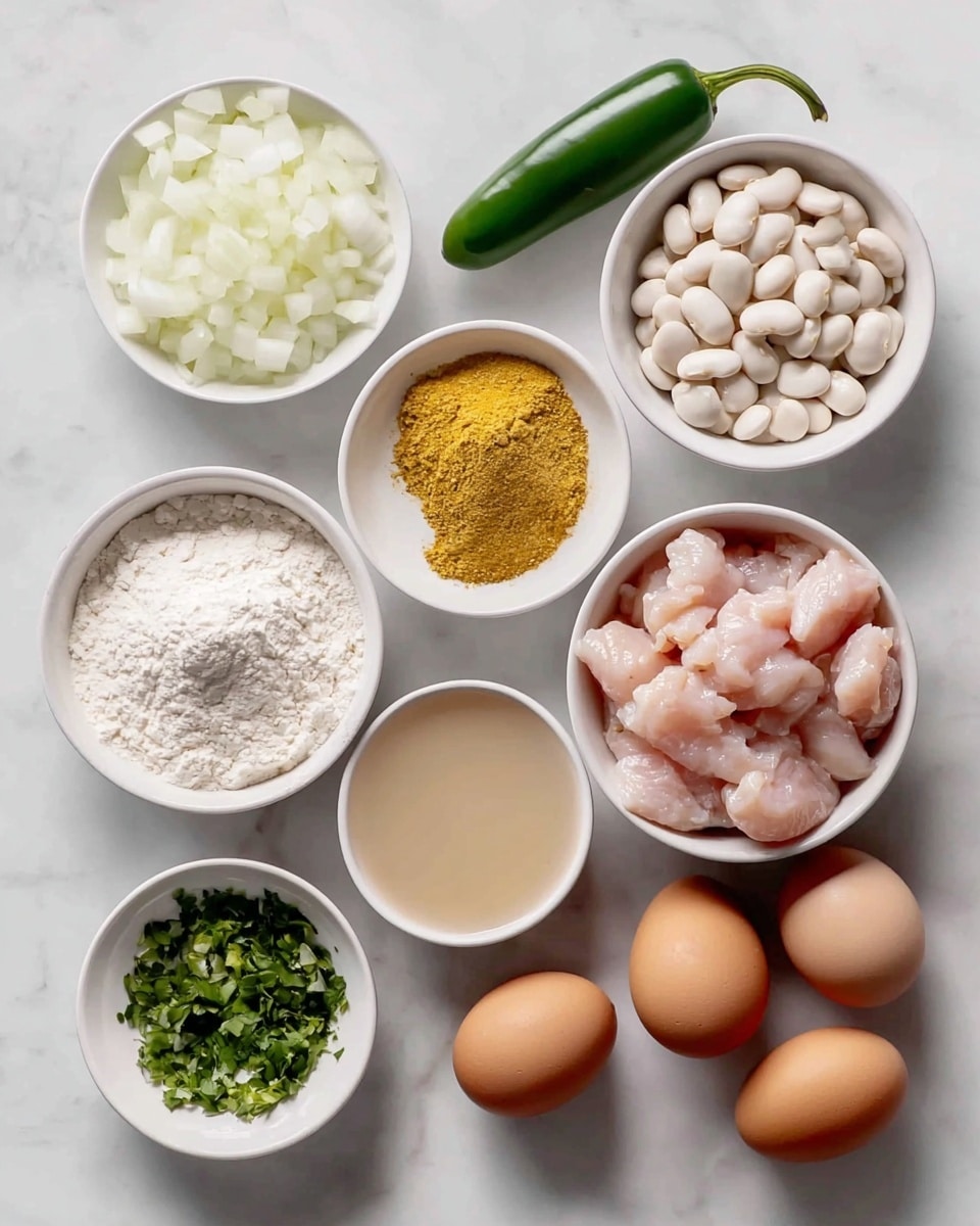 The image shows nine ingredients arranged neatly on a white marbled surface. In the center right, there is a white bowl filled with small, raw pink chicken pieces. Above it to the right, there is a white bowl with white beans. To the left of that is a green jalapeño pepper. Above and to the left of the chicken pieces, there is a white bowl filled with chopped white onions. Below the onion bowl, there is a small white bowl of yellow seasoning powder. Below that is another small white bowl containing a white powder, likely flour. To the left and slightly below the chicken bowl, there is a small white bowl filled with chopped green herbs or vegetables. To the right of the herb bowl are three brown eggs placed together. Above the eggs and slightly to the left is a small bowl filled with a light yellow liquid, likely oil or vinegar. All the bowls and ingredients are set on the smooth white marbled background. photo taken with an iphone --ar 4:5 --v 7