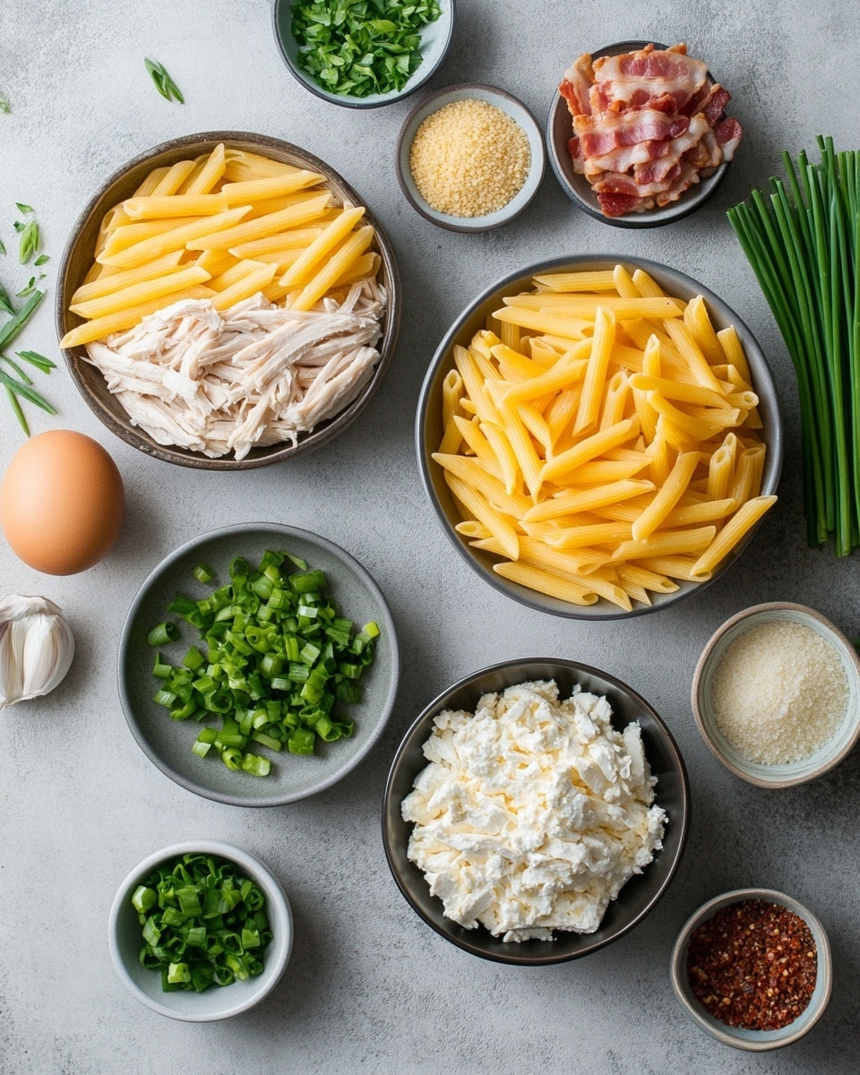 This image shows a black pan filled with creamy penne pasta and pieces of grilled light golden chicken on top. The pasta is smooth and coated with a rich, pale yellow sauce, and the chicken pieces have browned spots from cooking, adding a slight texture contrast. Small bright green parsley flakes are sprinkled evenly over the dish for color. A wooden spoon is lifting some pasta and chicken from the pan. The pan rests on a white marbled surface with some blurred green herbs in the background. photo taken with an iphone --ar 4:5 --v 7