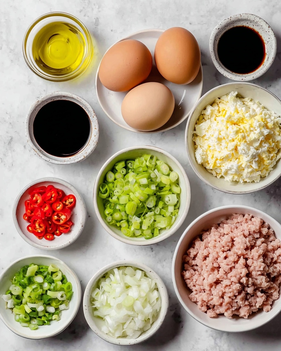 The image shows a top view of several white bowls arranged on a white marbled surface, each containing different ingredients. Starting from the top left, there is a bowl filled with golden-yellow oil, next to it is a bowl with finely chopped bright green spring onions. To the right are two brown eggs placed side by side. Below the oil bowl is a smaller bowl filled with thinly sliced red chili peppers with visible seeds. Next to it, there are two small bowls containing dark soy sauce placed vertically. Below the chili, there is a bowl with small blocks of white onion. On the bottom left, a bowl is filled with thinly sliced light green leek pieces. The largest bowl at the bottom right contains pale pink ground meat, and above it, a bowl filled with chopped boiled eggs showing a mix of white and yellow bits. All the bowls are neatly arranged and the colors of the ingredients create a fresh and vivid contrast. Photo taken with an iphone --ar 4:5 --v 7