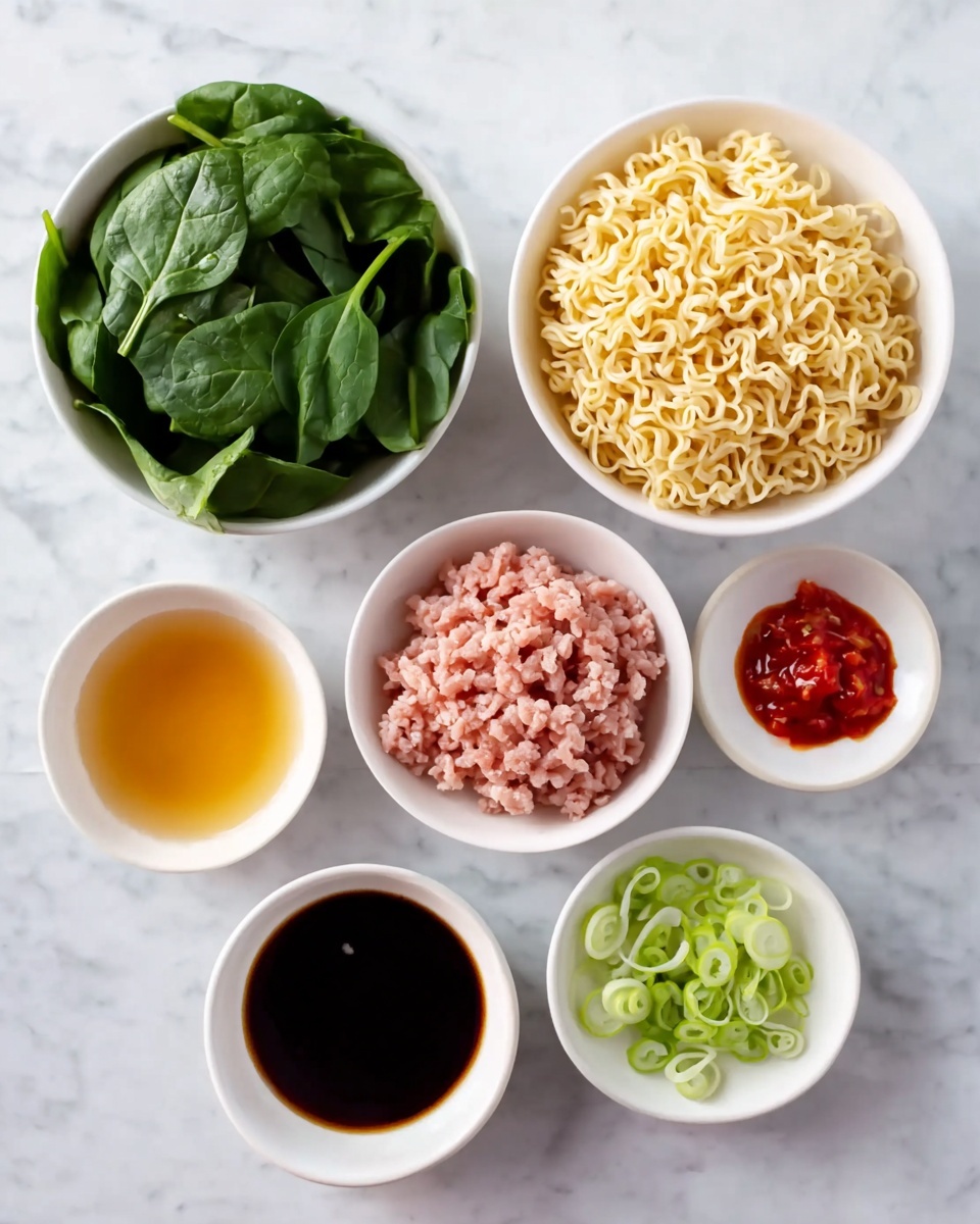 A white bowl filled with a ramen dish on a white marbled surface. The ramen has four main layers: dark green cooked leafy vegetables on the upper left, brown cooked minced meat mixed with small green pieces on the lower left, bright red pickled ginger strips piled in the center, and pale yellow wavy noodles on the right side partially submerged in dark brown broth. A white ceramic spoon rests inside the bowl on the right, partially under the noodles, with dark brown wooden chopsticks placed across the bowl above the spoon. Photo taken with an iphone --ar 4:5 --v 7
