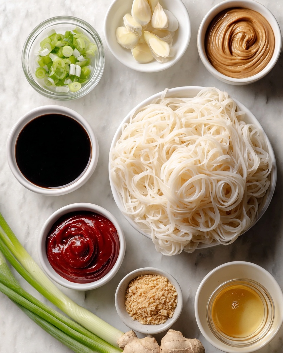 The image shows a black pan filled with shiny brown noodles coated in a sauce, mixed evenly with small pieces of white nuts and bright green chopped scallions scattered on top. A wooden spoon is lifting some noodles on the left side, showing their smooth and slightly glossy texture. The pan rests on a white marbled surface, adding a clean and light background contrast to the warm color of the noodles. photo taken with an iphone --ar 4:5 --v 7