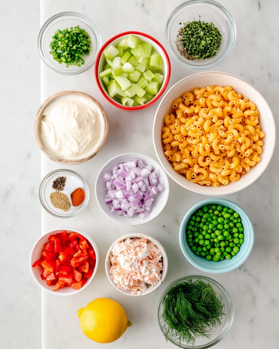 The image shows ten small bowls arranged on a white marbled surface, each filled with different ingredients. Starting at the top left, there is a white bowl with chopped green celery, next to it a white bowl filled with cooked elbow macaroni. Below the celery is a white bowl with thick white dressing or sauce, and beside it a white bowl with chopped red onion. Below these in the middle is a white bowl with green peas and next to it a white bowl with chopped green chives. Toward the bottom left is a clear glass bowl holding mixed spices of orange, black, and white colors, next to it another clear bowl filled with chopped green herbs. At the bottom left corner, a white bowl contains chopped red bell pepper, and just to the right is a white bowl full of crab style imitation meat chunks. A whole lemon sits near the red bell pepper bowl. The photo was taken with an iphone --ar 4:5 --v 7